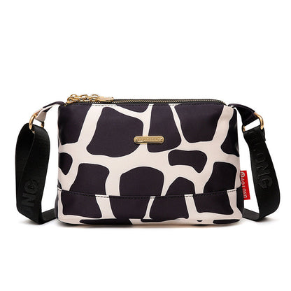 Crossbodytas met meerdere zakken en print voor dames